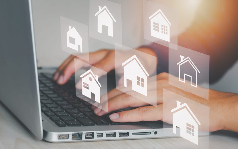 Real estate concept business, home insurance and real estate pro Real estate concept business, home insurance and real estate protection. Buy and sell houses and real estate online on a virtual screen.